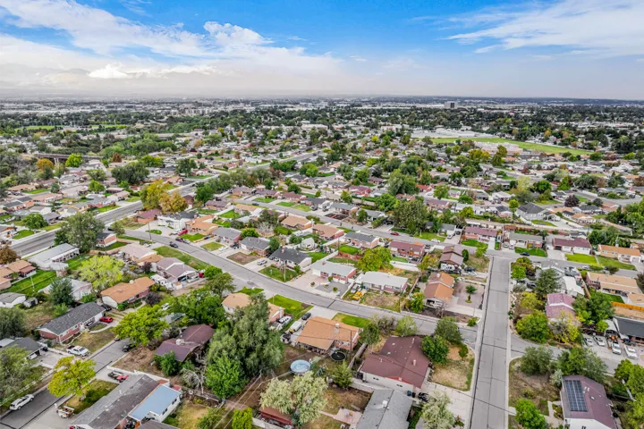 Aerial perspective showcasing a residential neighborhood with a mix of single-story and multi-story homes