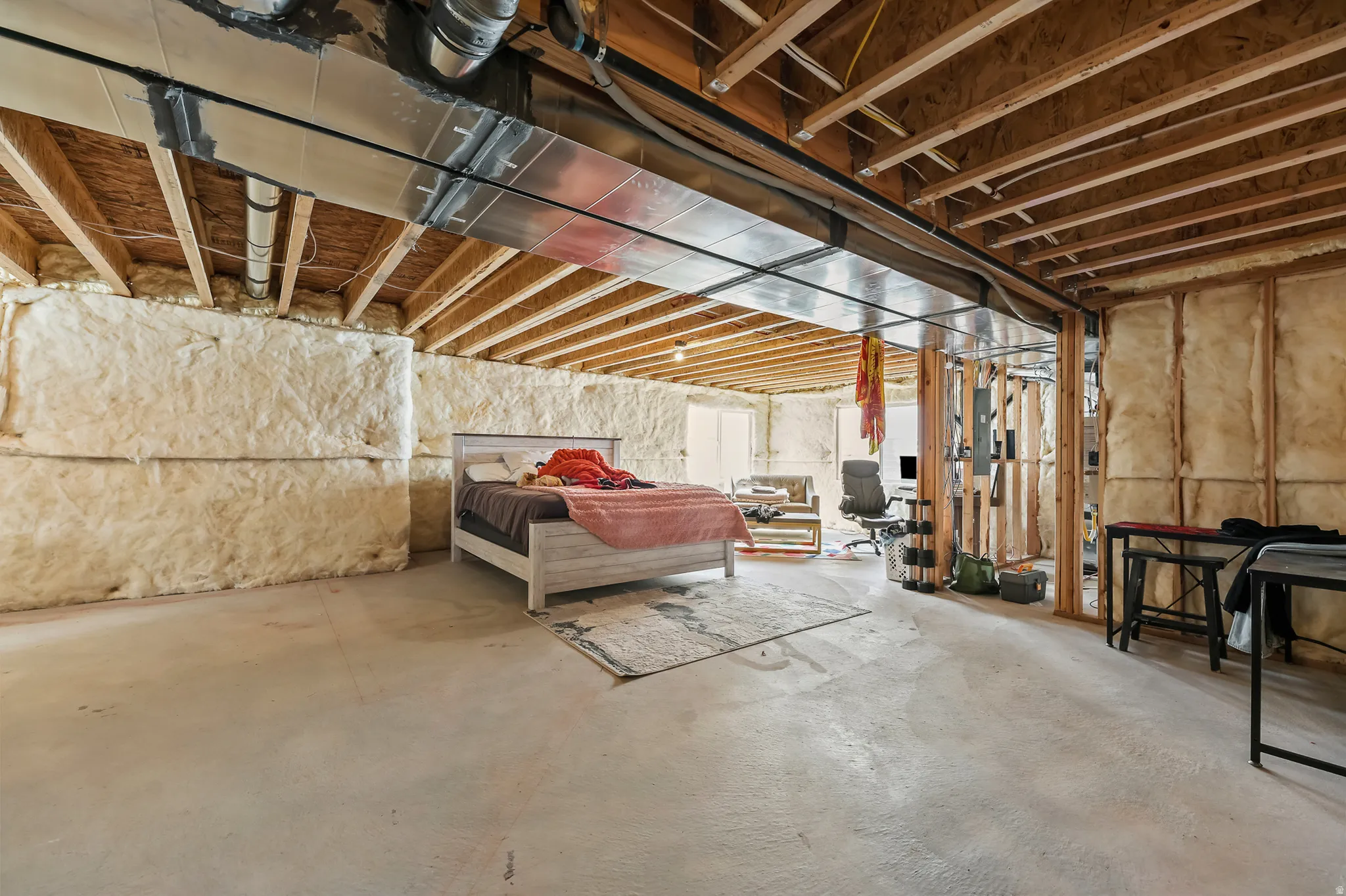 Unfinished basement with spray foam insulation,