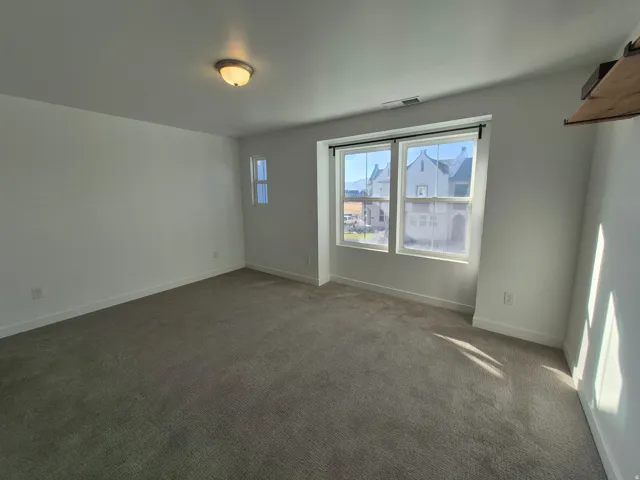 Neutral-toned carpeting paired with white wall finishes