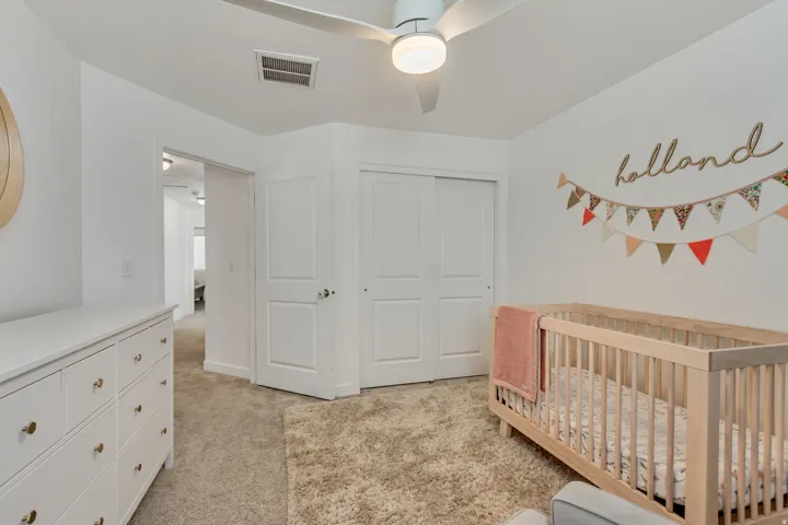 White interior walls with neutral carpeting