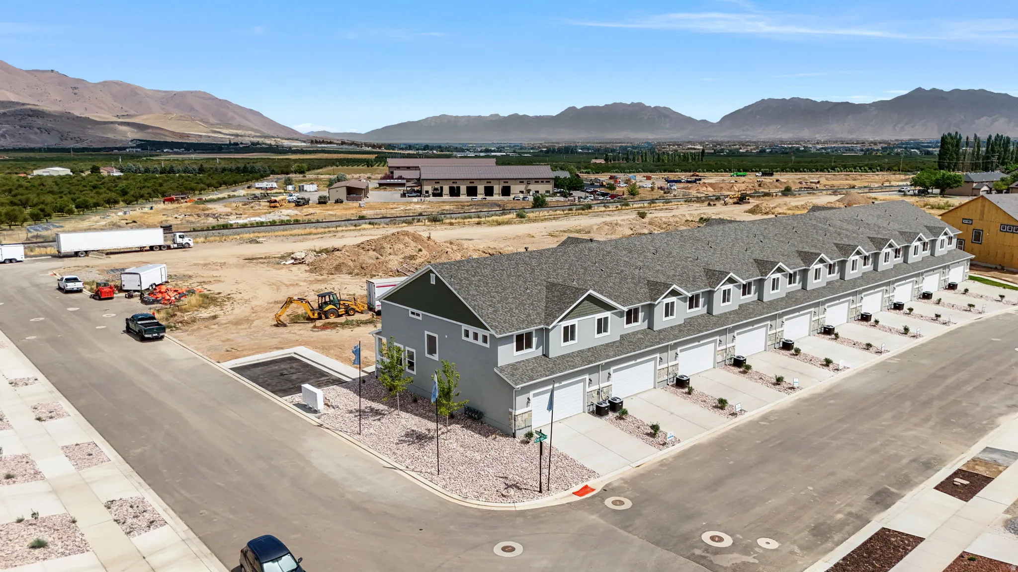New construction townhomes featuring gray siding and white trim