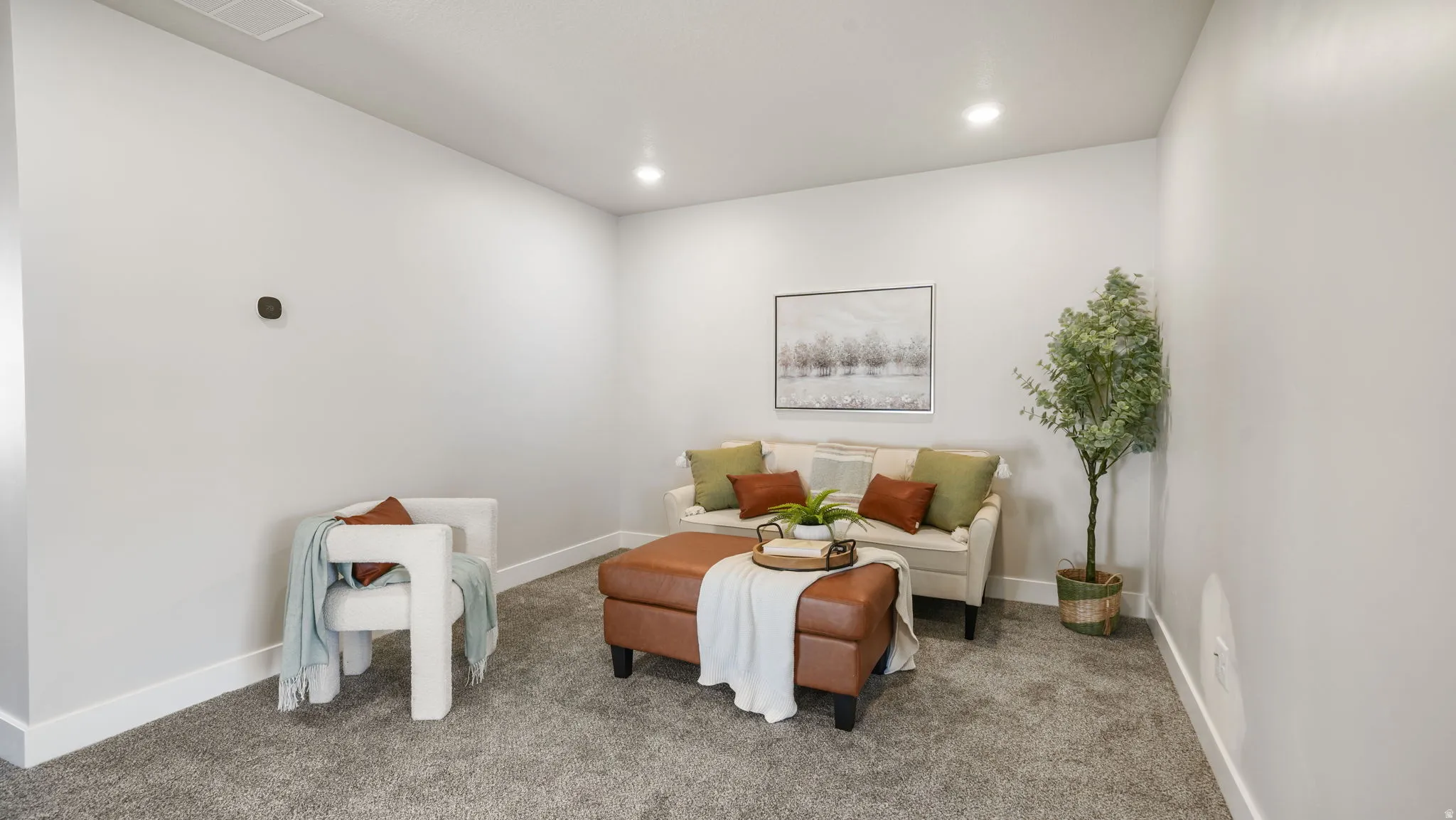 Recessed ceiling lighting, light gray wall paint, white baseboards, and gray carpeted flooring
