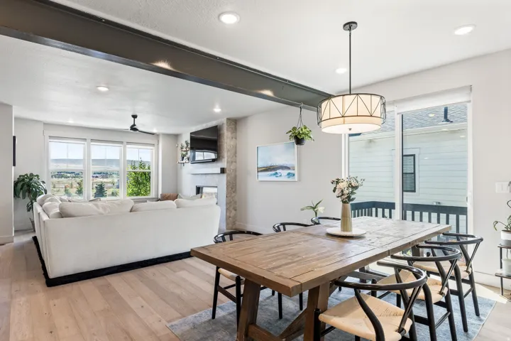 Recessed lighting, wood-finish flooring, and a sliding glass door