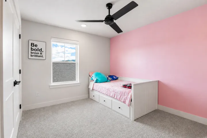 Recessed lighting, ceiling fan, white paneled door with black hardware, white trim, and carpet flooring