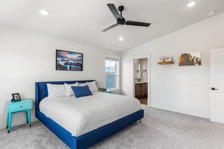 Recessed lighting with a ceiling fan, carpeted flooring, and a window with a mountain backdrop