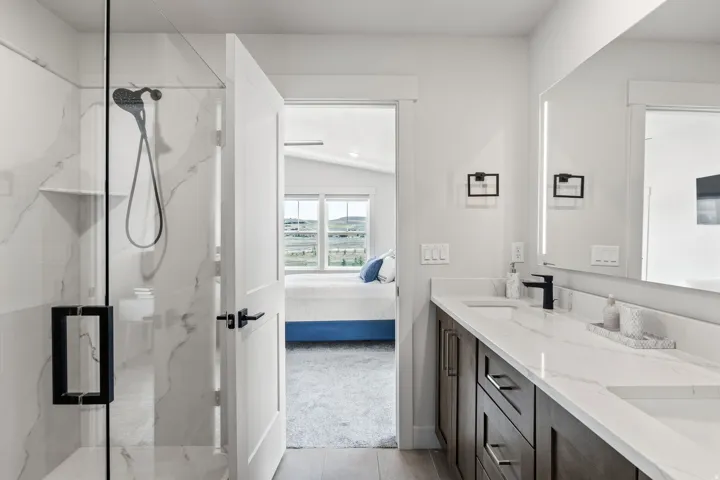 Walk-in shower with tile surround and glass enclosure
