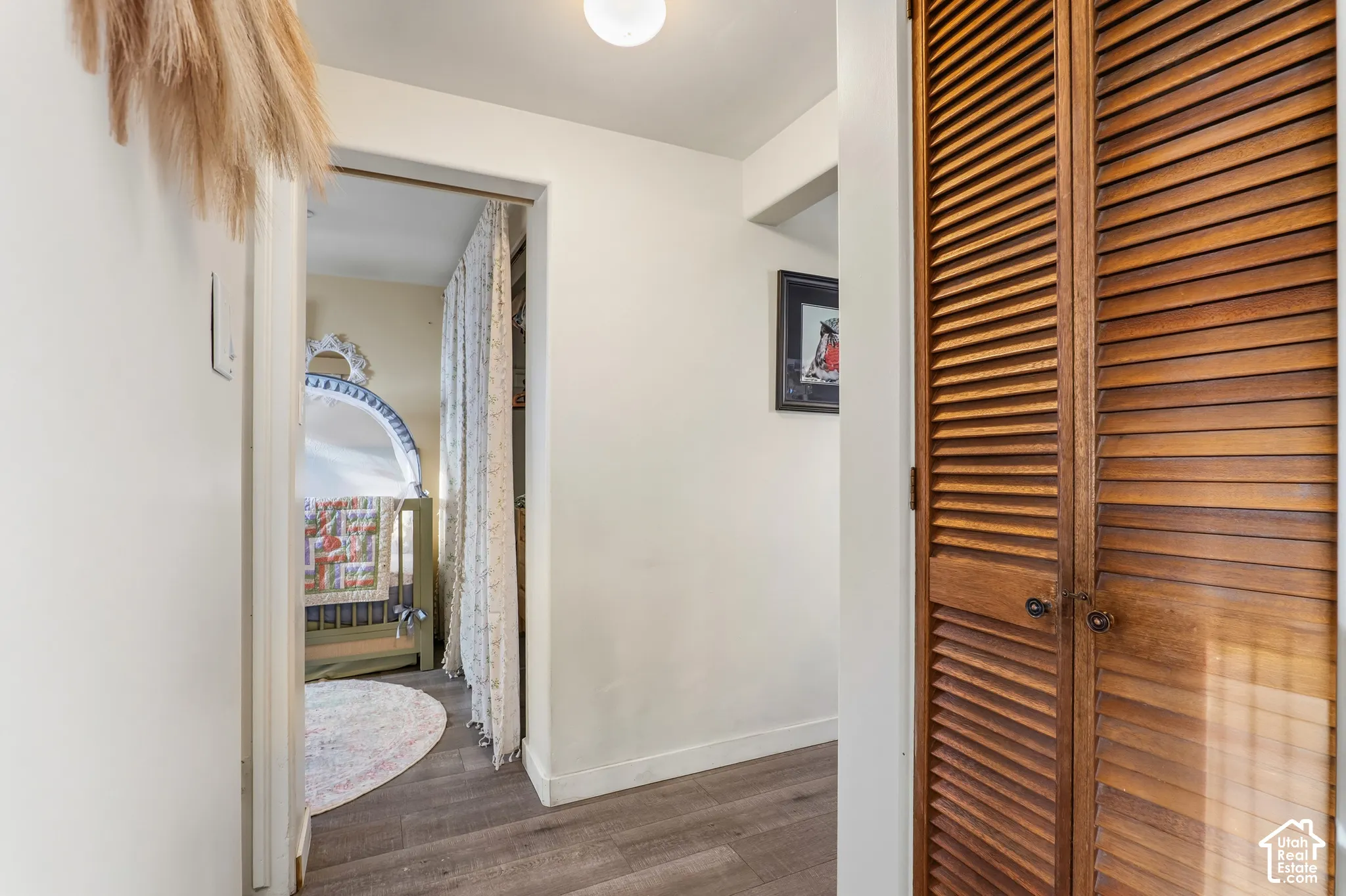 Wood-finish flooring with louvered bi-fold doors