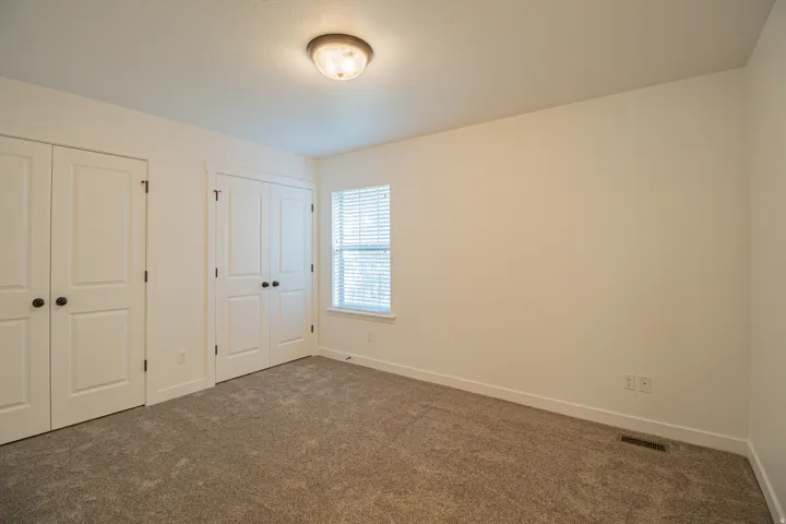 Textured carpet flooring with white trim