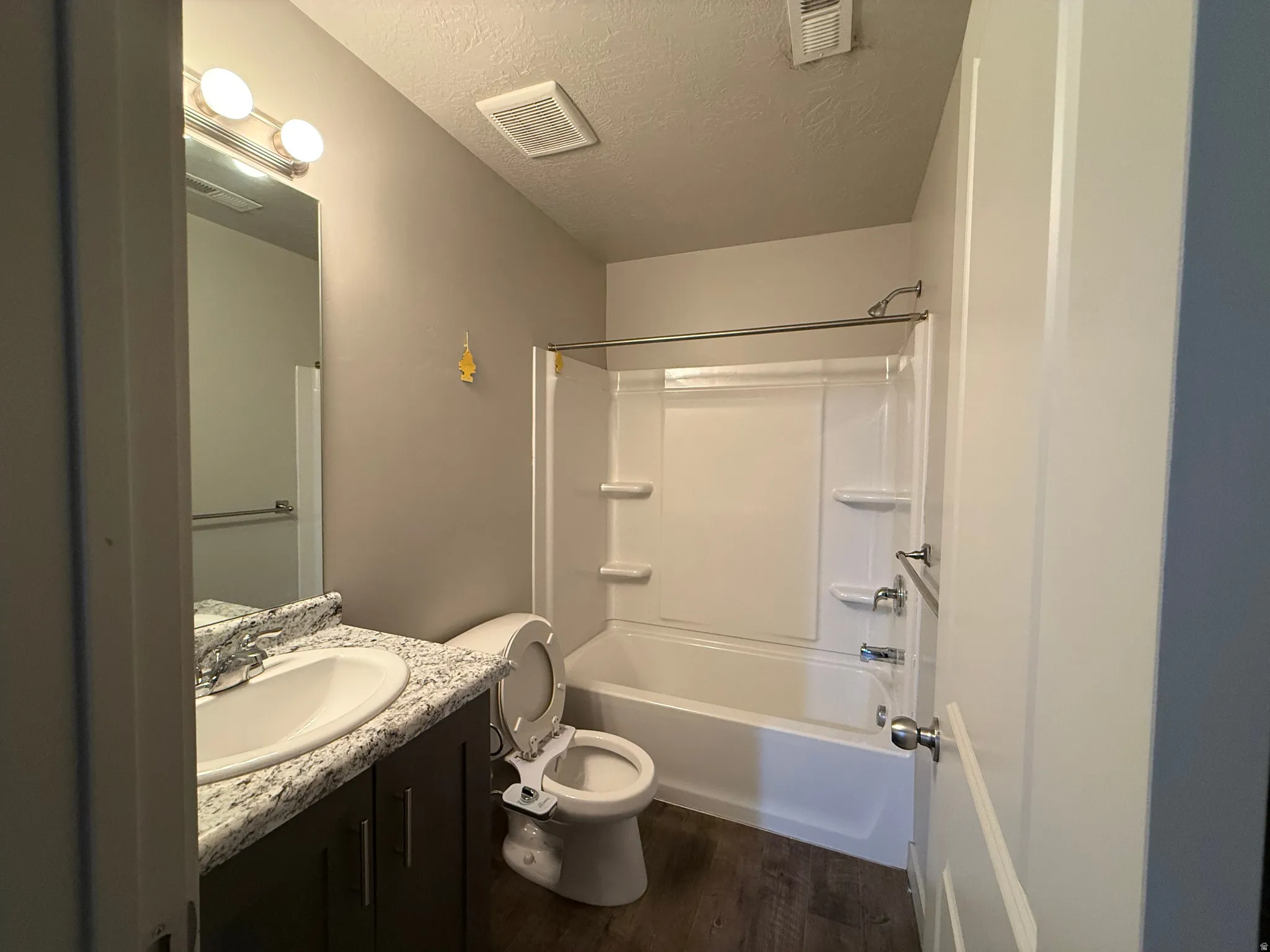 Vanity with an integrated sink and stone-look countertop