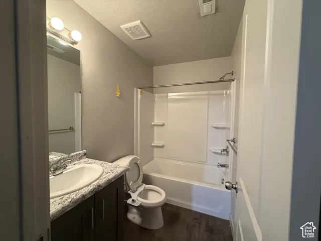 Vanity with an integrated sink and stone-look countertop