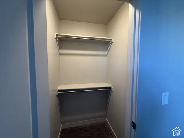 Built-in closet shelving with integrated hanging rods