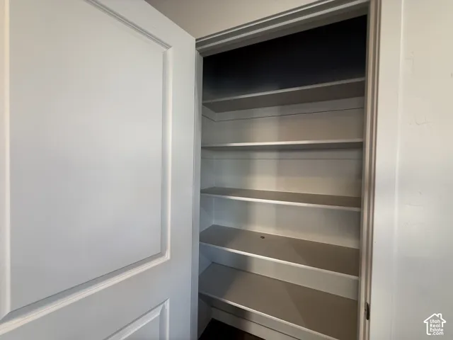 White paneled door with integrated shelving