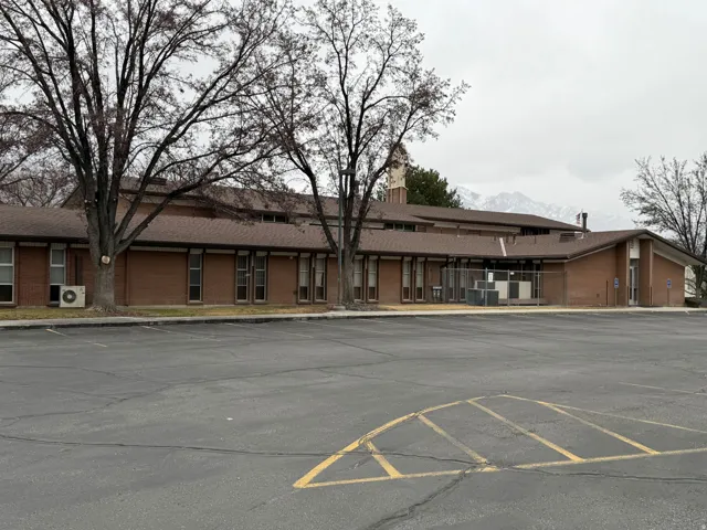 Brick exterior structure with prominent brown roofing