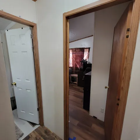 Wood-finish flooring throughout, with solid core doors and wood-finish door frames