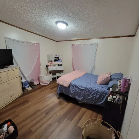 Wood-finish flooring with a neutral wall color and trim