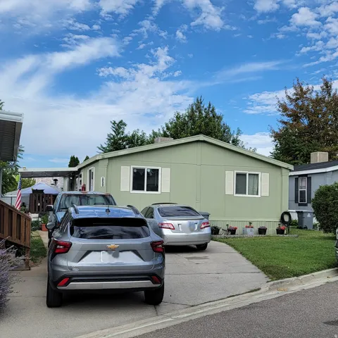 Light green exterior with white window shutters