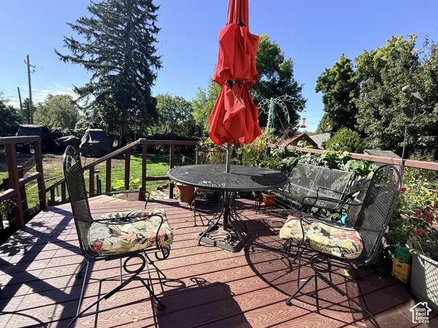 Spacious outdoor deck with composite decking and wood railing