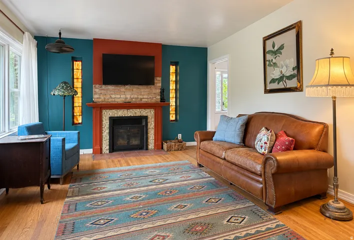 Light and bright living room with fireplace and hardwood floors