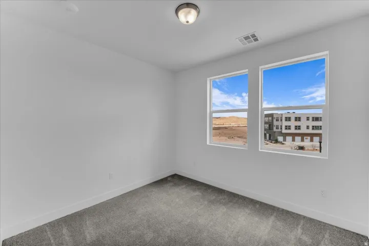 Dual windows with desert and urban scenery