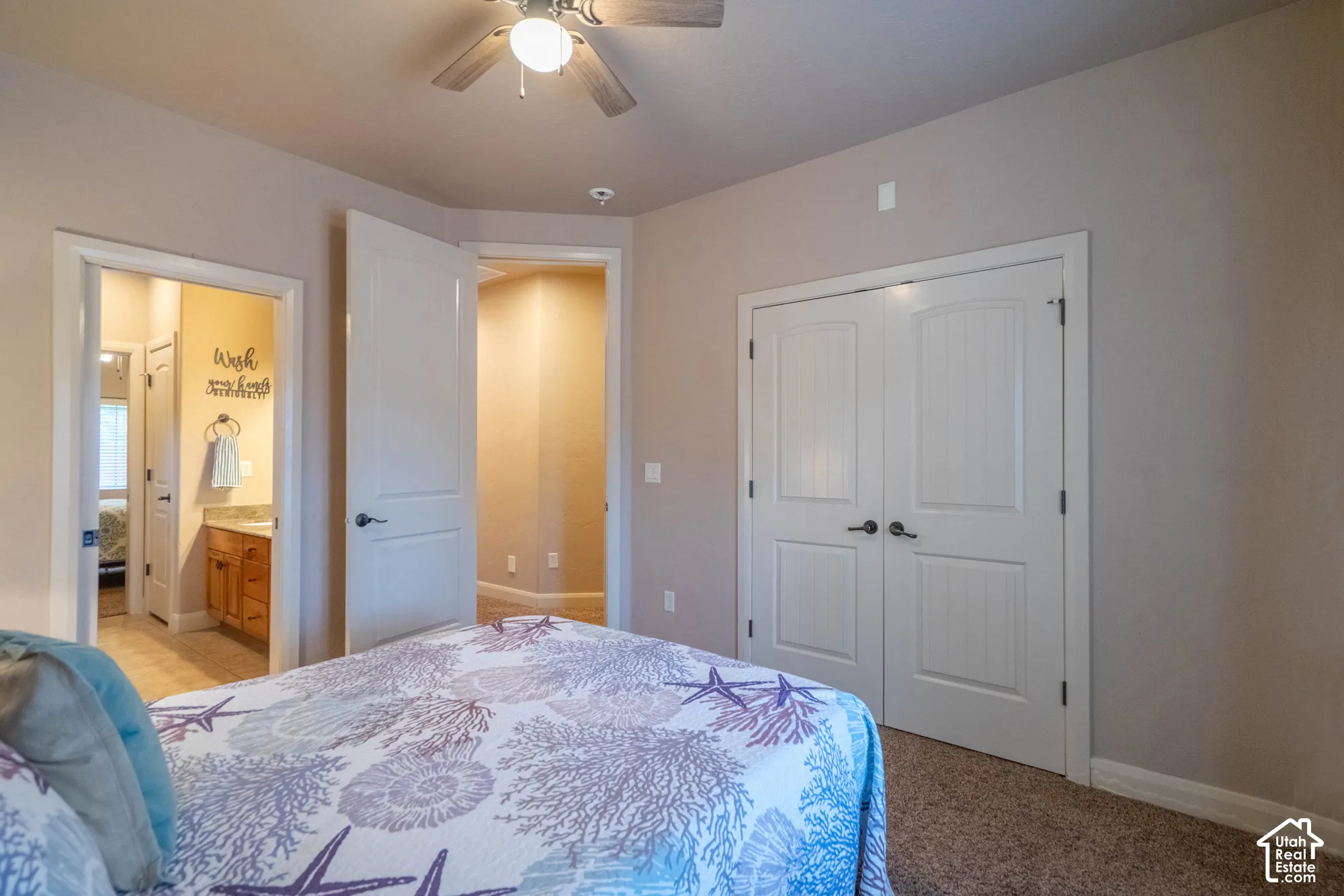Recessed lighting, wood-finish ceiling fan with light, and carpeted flooring