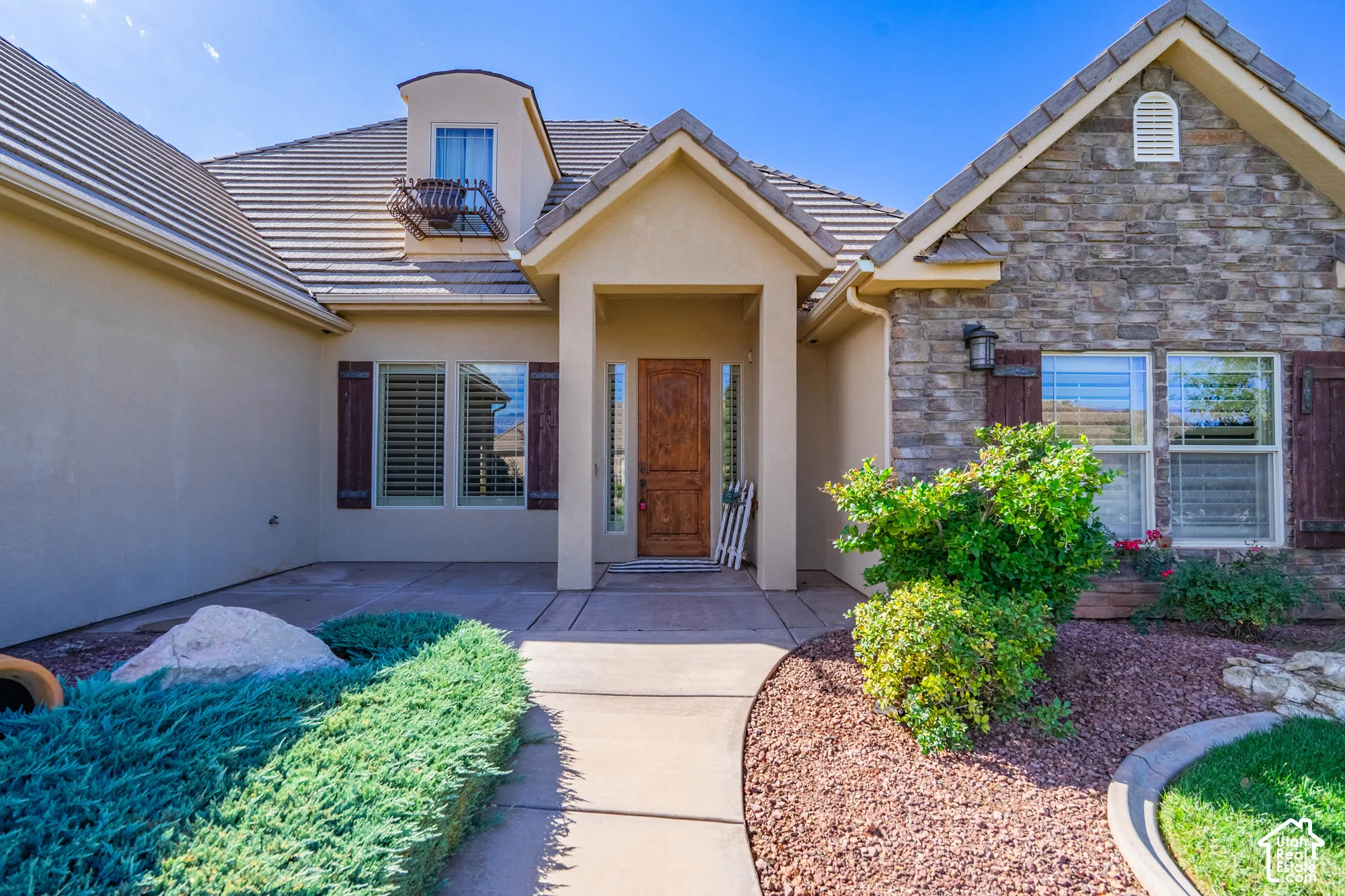 Stone accent facade with a stucco exterior