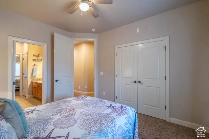Recessed lighting, wood-finish ceiling fan with light, and carpeted flooring