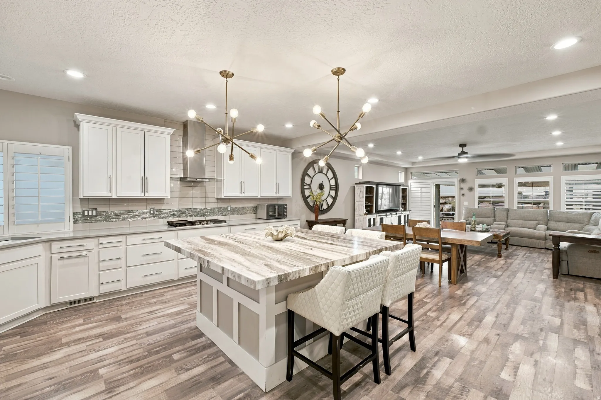 Open concept living area with wood-finish flooring