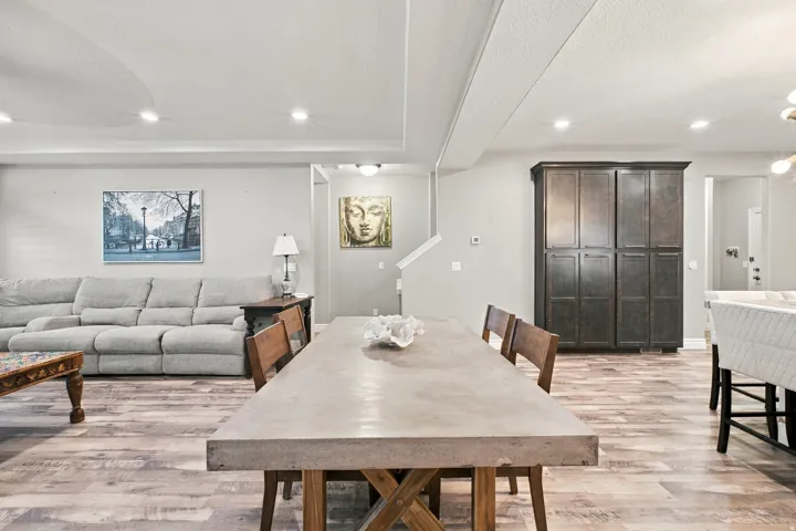 Wood-finish flooring throughout, complemented by recessed ceiling lighting