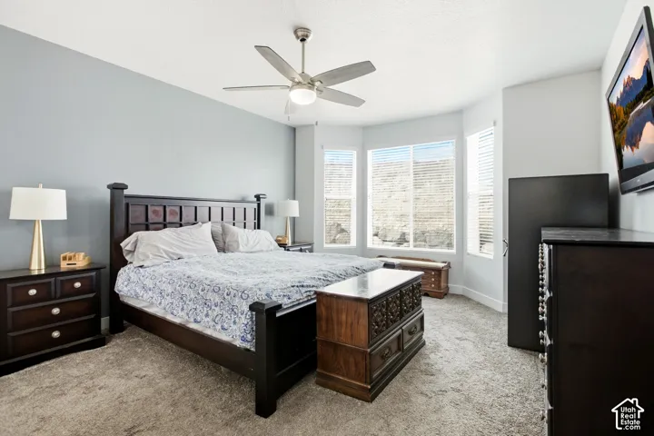 Large primary bedroom with big windows