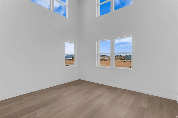 High ceilings, wood-finish flooring, and multiple windows