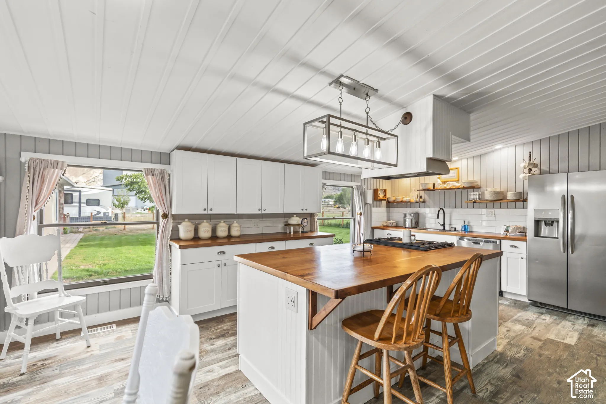 White cabinetry and wood-finish countertops