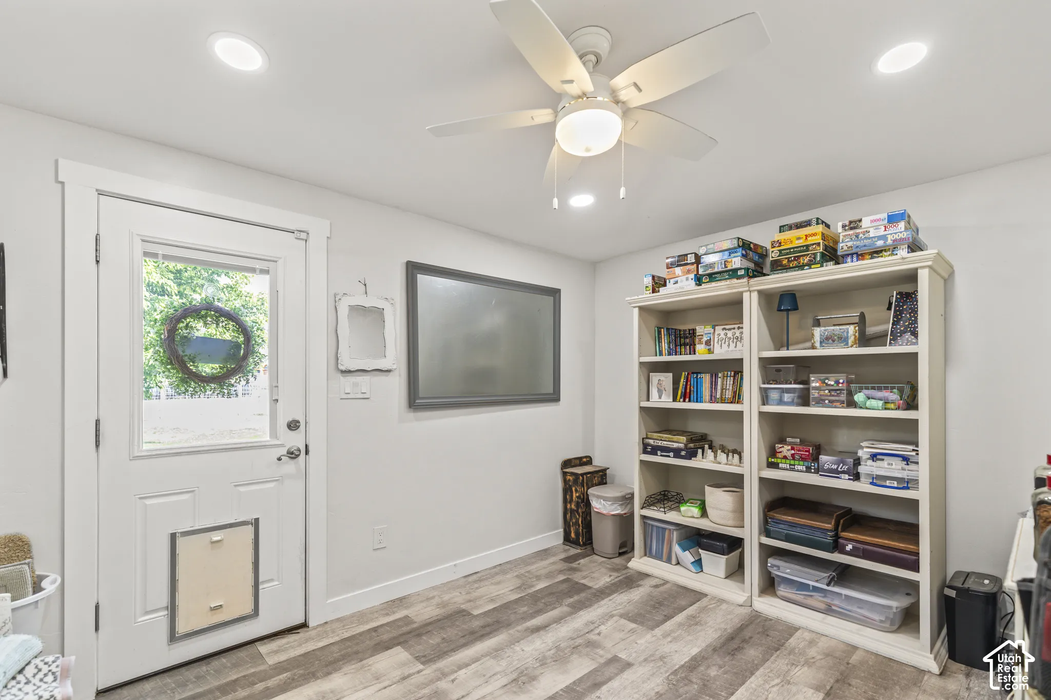 Wood-finish flooring, recessed lighting, and a ceiling fan