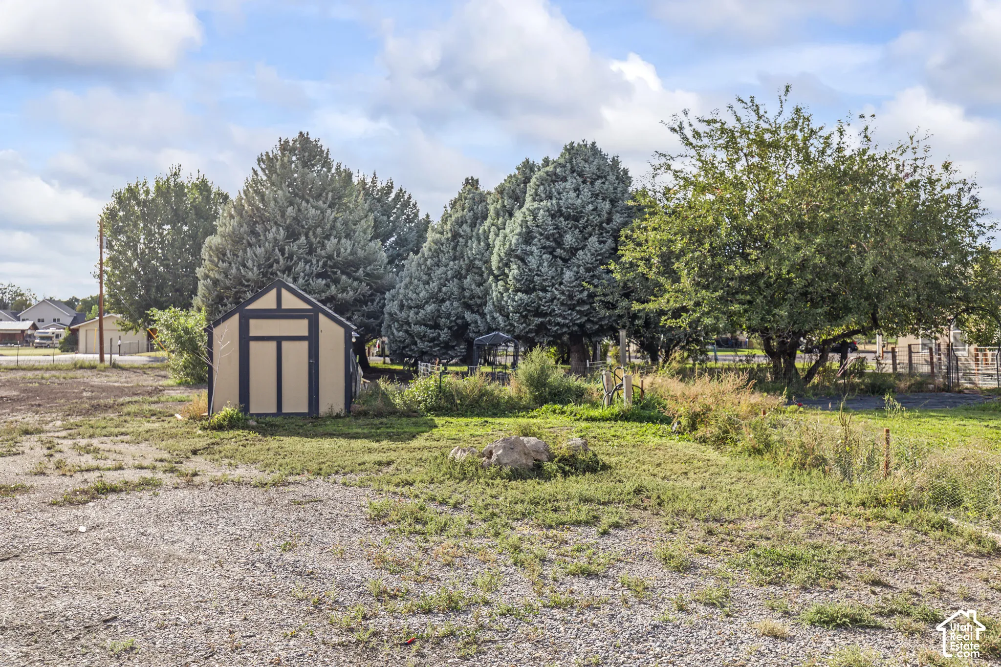 Storage shed with a pitched roof and neutral paneling