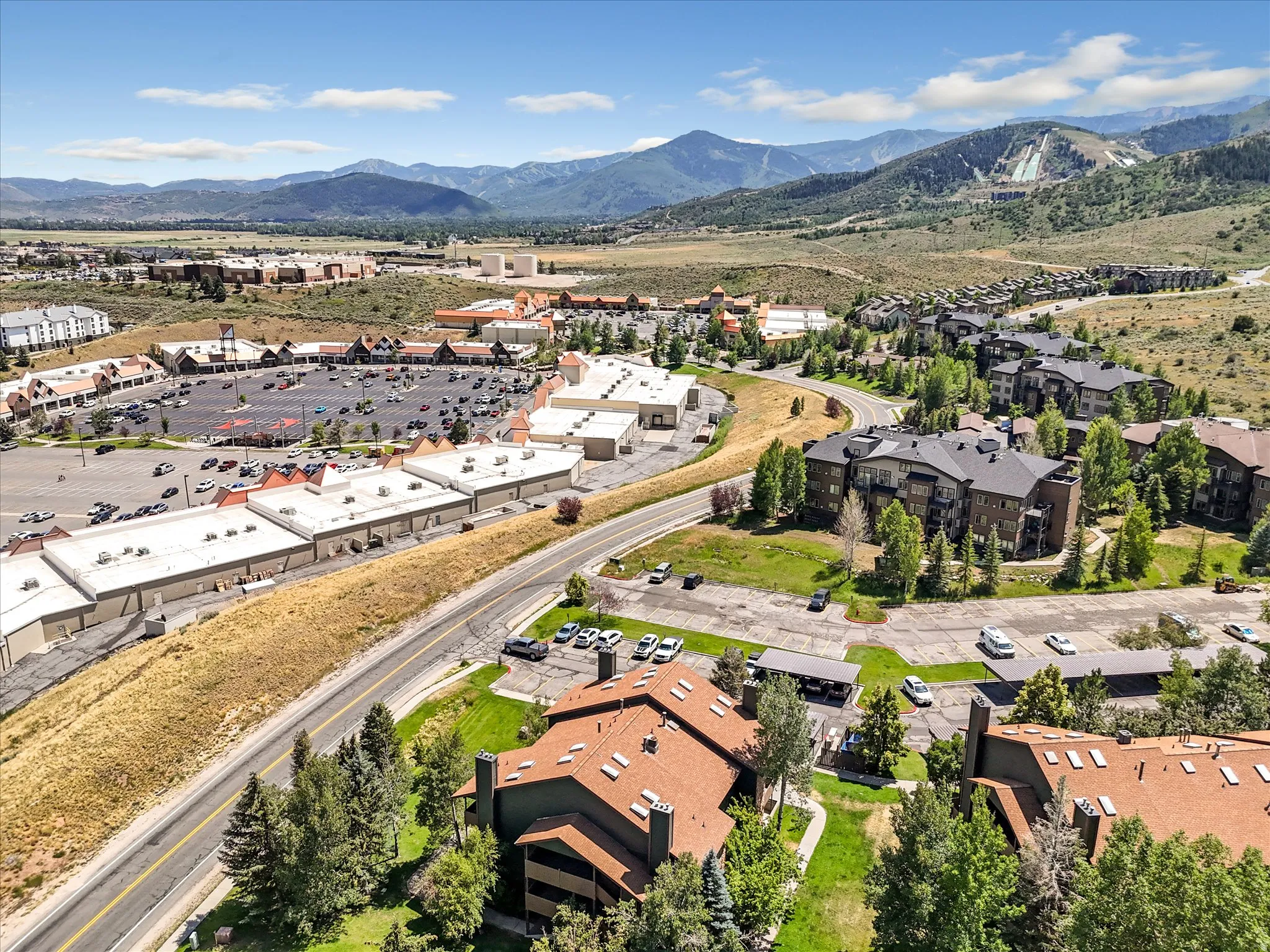 Expansive mountain scenery with diverse residential buildings and retail structures