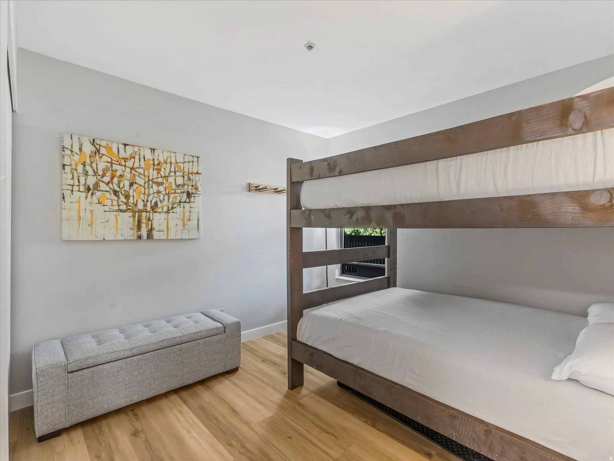 Wood-finish flooring with a neutral wall color