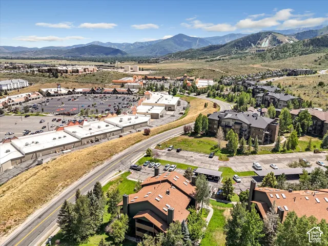 Expansive mountain scenery with diverse residential buildings and retail structures
