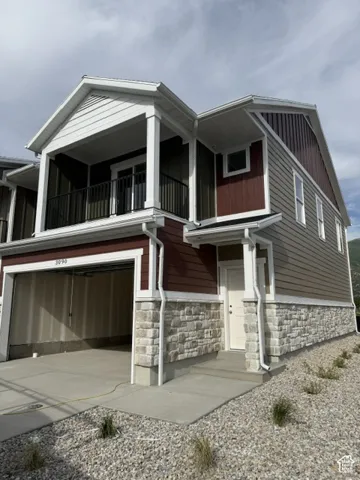 Multi-toned exterior siding with stone accents