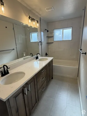 Double vanity with integrated sinks and quartz countertops