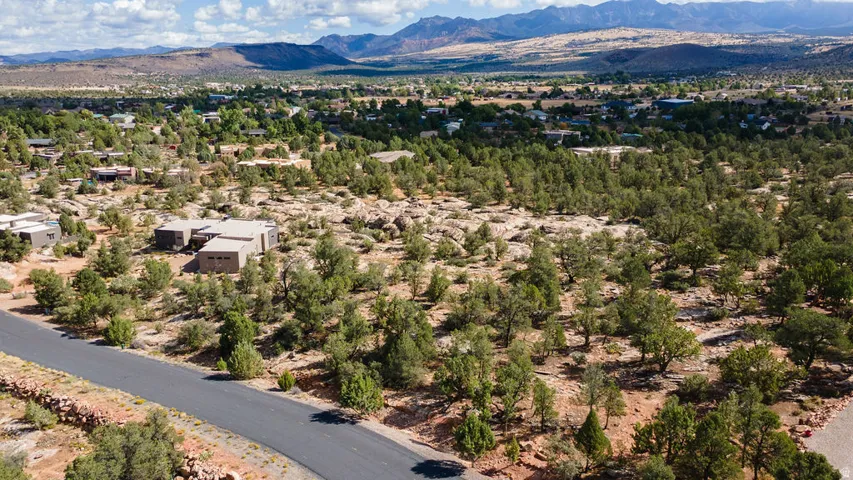 Paved road frontage with surrounding natural desert landscaping