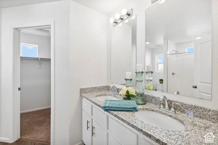 Dual vanity with granite-style countertops and undermount sinks