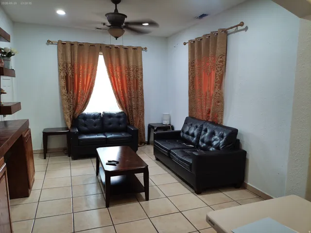 Recessed ceiling lighting, ceiling fan, tile flooring, and built-in shelving