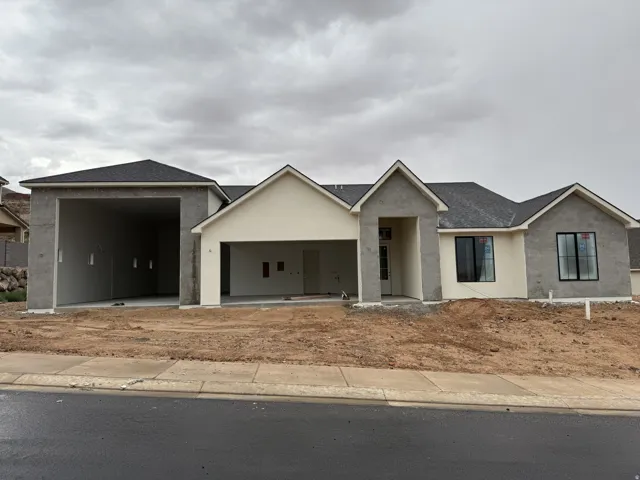 Contemporary architectural design featuring a multi-gabled roofline and a combination of stucco finishes
