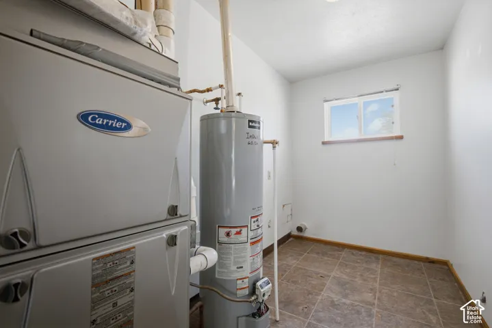 Carrier HVAC system, water heater, tiled flooring, and a single window