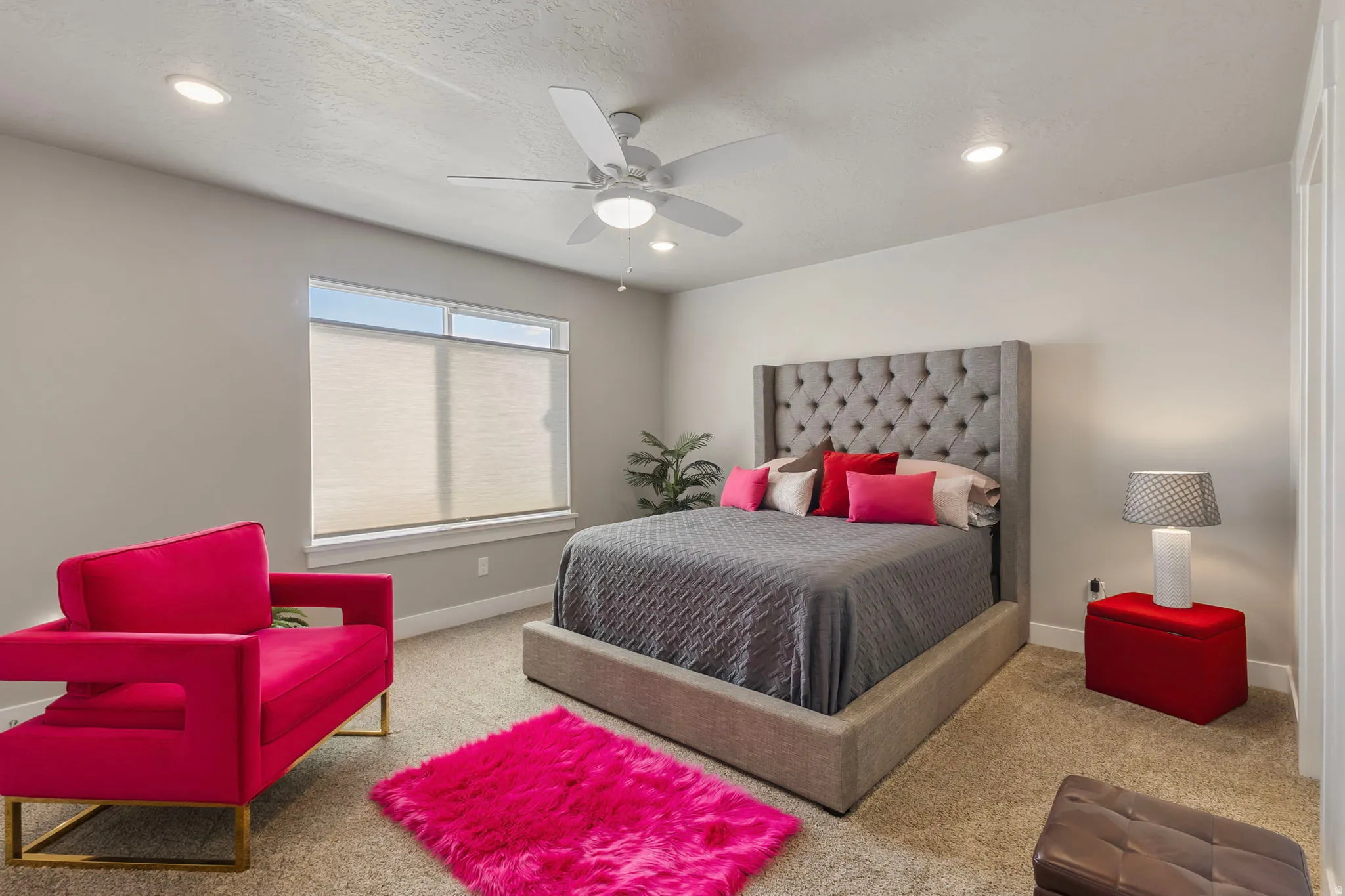Recessed lighting, ceiling fan, neutral wall tones, window with roller shades, and carpeted flooring