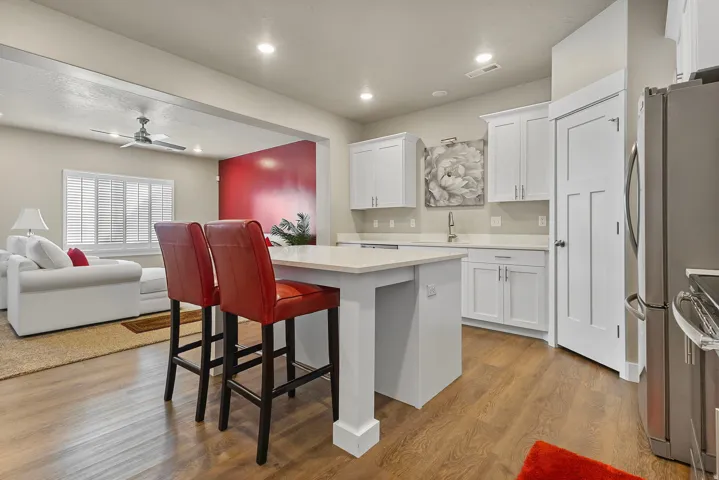 Kitchen island with seating featuring a light-toned countertop