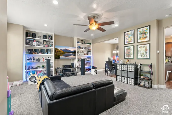 Recessed lighting, ceiling fan, and carpeted flooring
