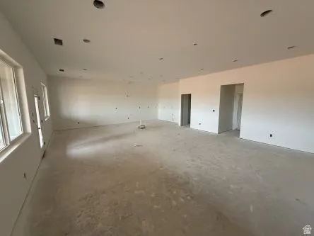 Recessed lighting, large windows, and an open floor plan
