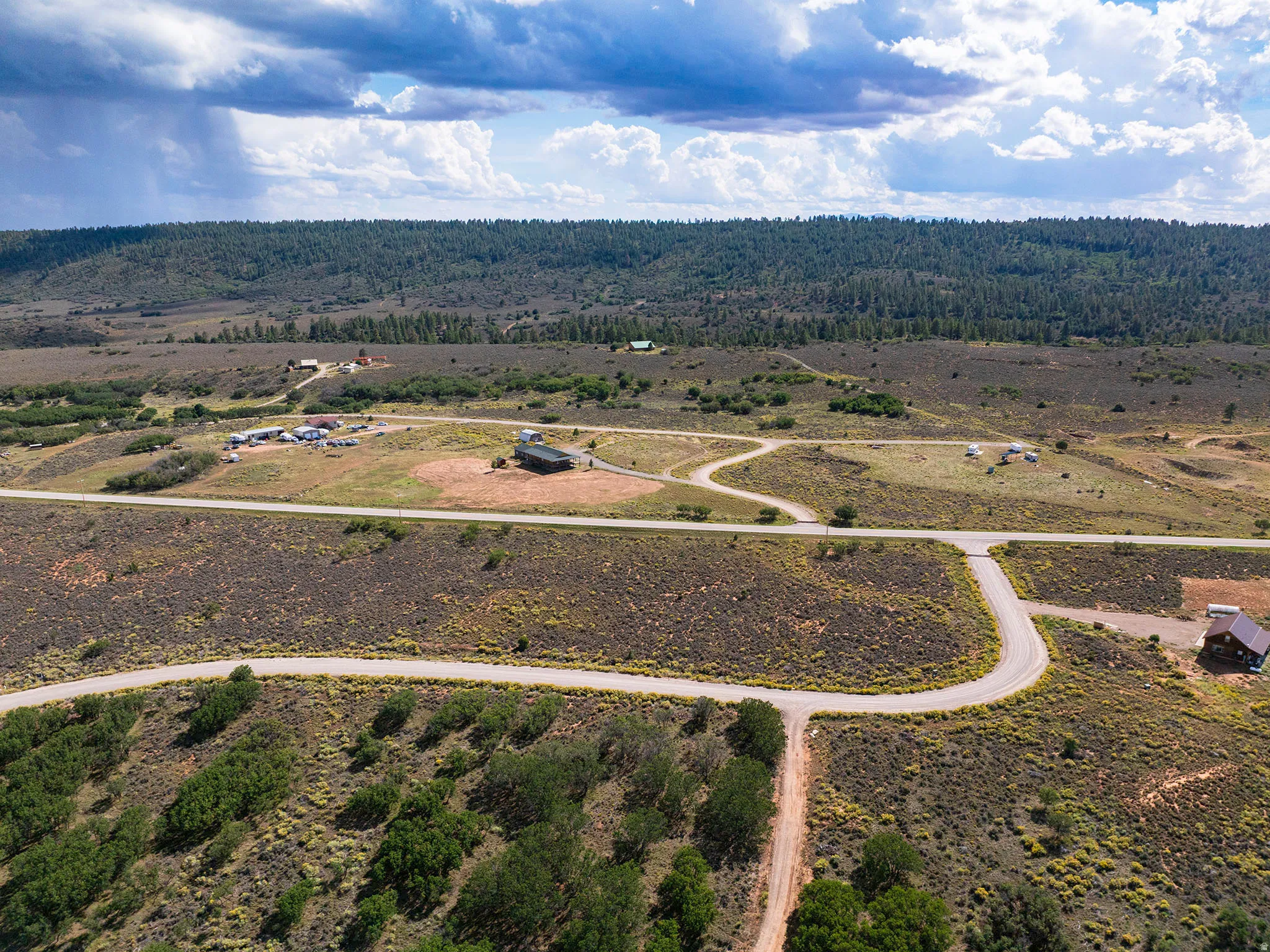 Expansive rural landscape with established roads and scattered structures