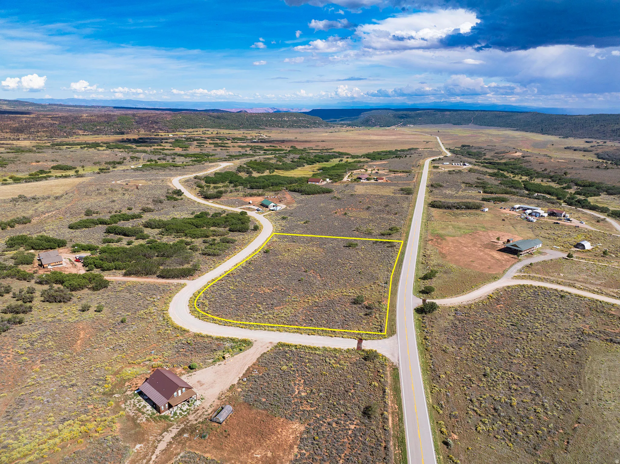 Expansive undeveloped lot with direct road frontage and a curved internal road
