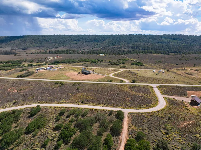 Expansive rural landscape with established roads and scattered structures